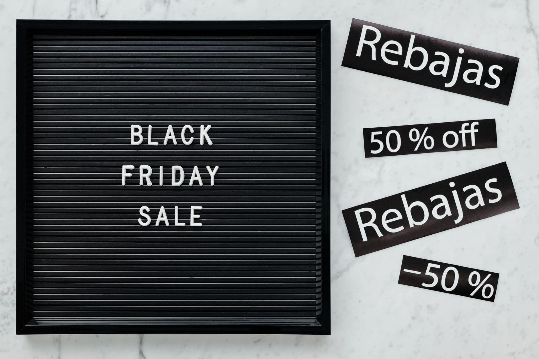 Black Friday sale board featuring discounts in English and Spanish for seasonal promotions.
